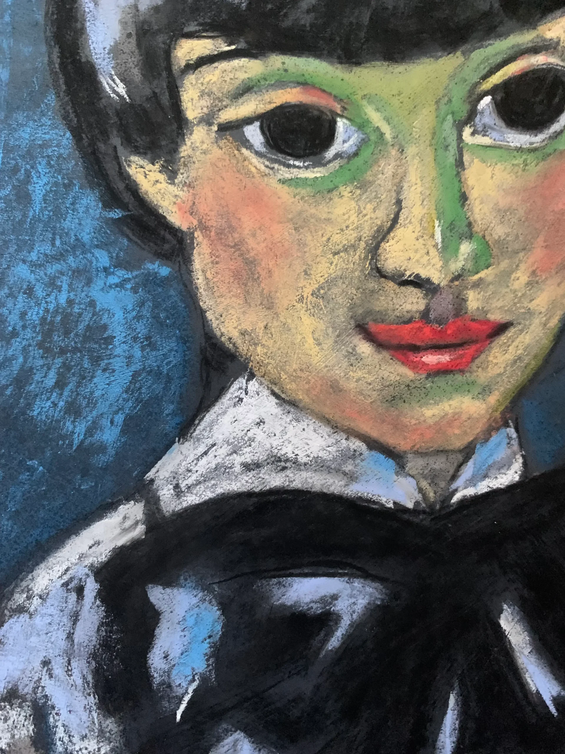An original expressionist theatrical portrait in soft pastel by Savchenko, depicting a Pierrot-style figure with short dark hair, a green shadow mask around the eyes, red lips, and a large black bow tie against a textured blue background on A3 format.