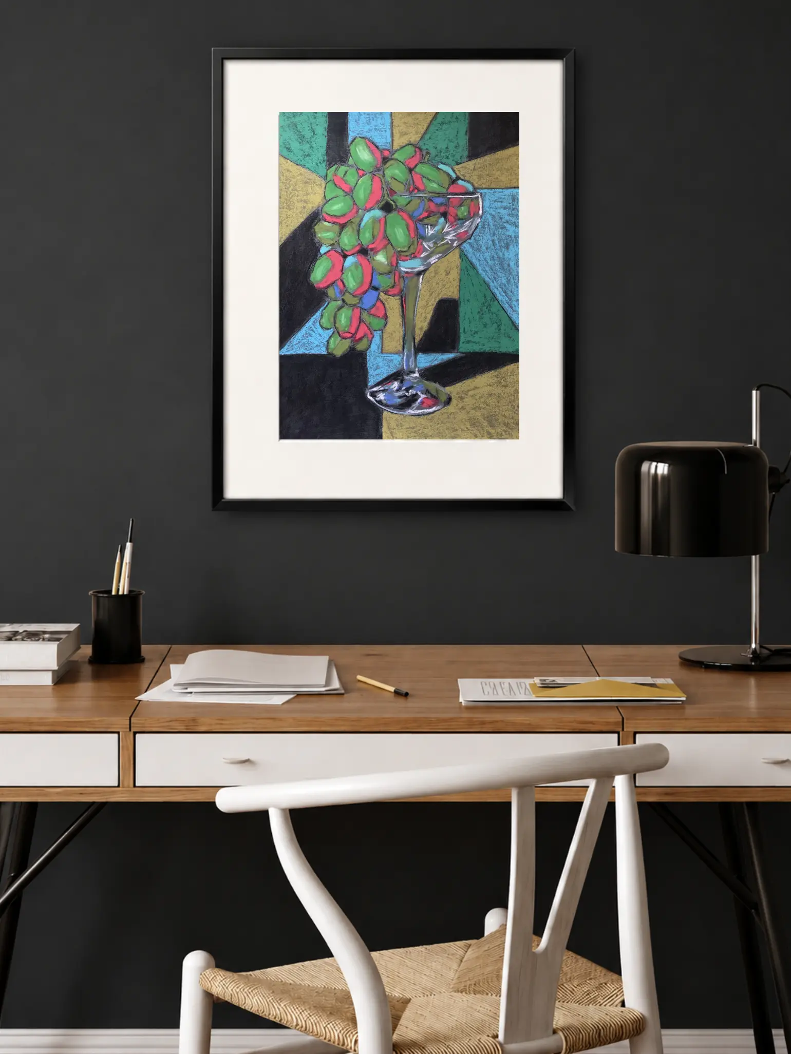 An original cubist still life painting in soft pastel by Savchenko, depicting green and pink grapes in a glass chalice against a geometric background of blue, green, gold, and black.