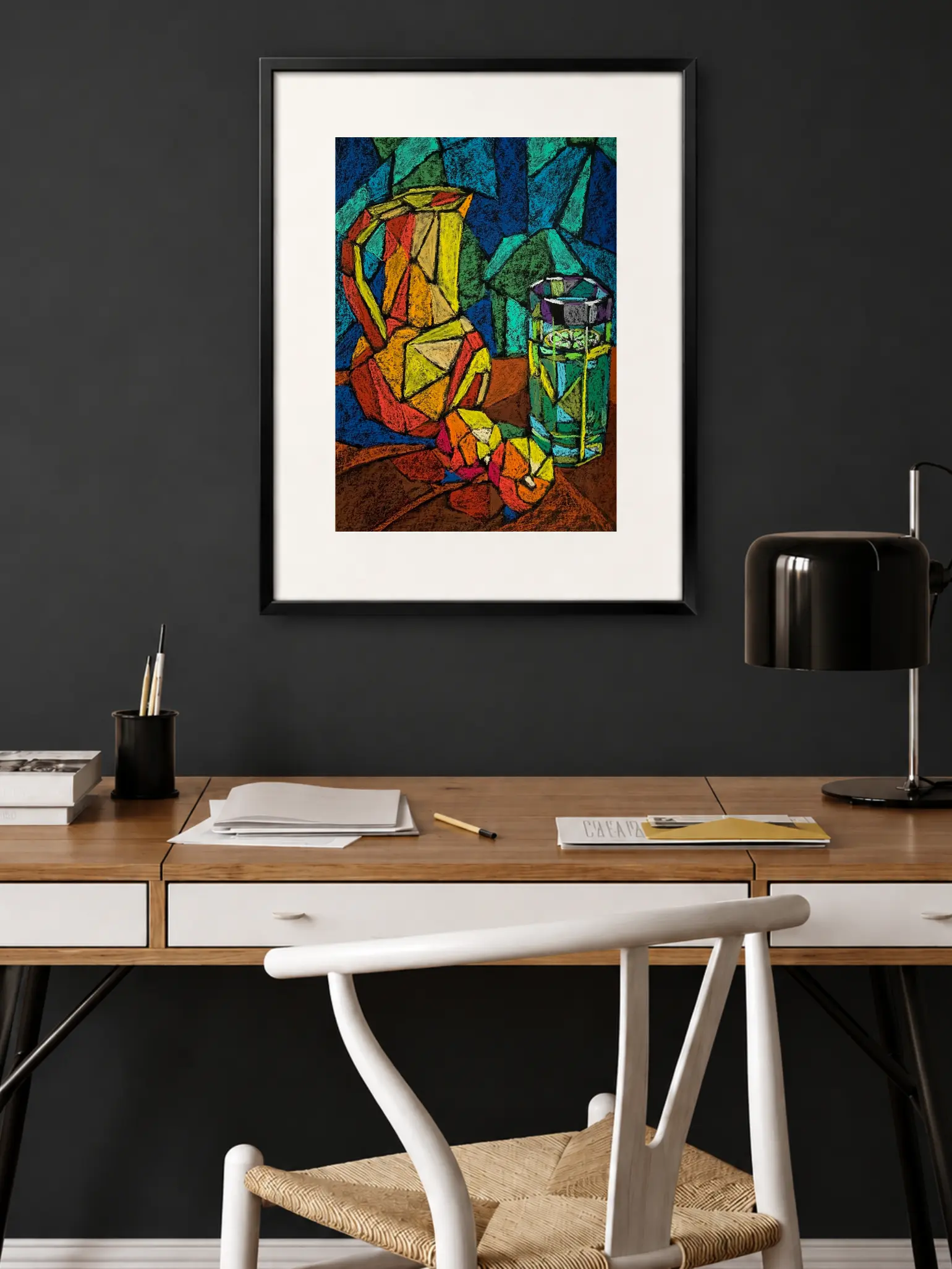 An original cubist still life painting with jug, showcasing a geometric yellow and orange pitcher next to a green glass with a lime slice on a brown table.