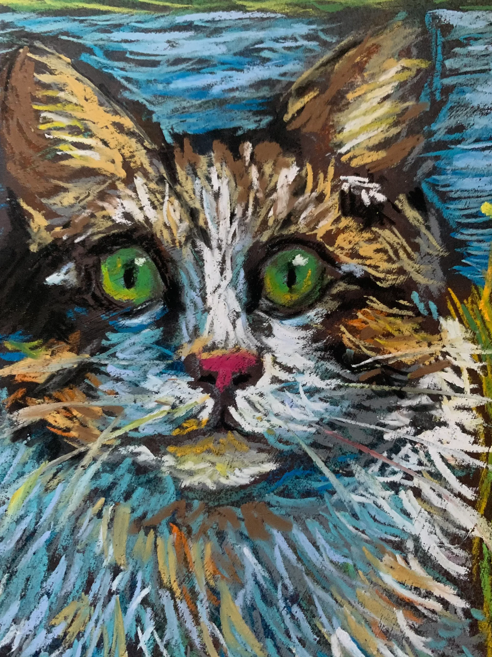 An original expressionist fluffy cat in grass painting in soft pastel by Savchenko, depicting a long-haired cat with bright green eyes sitting in a colorful meadow of wildflowers near a blue water background.