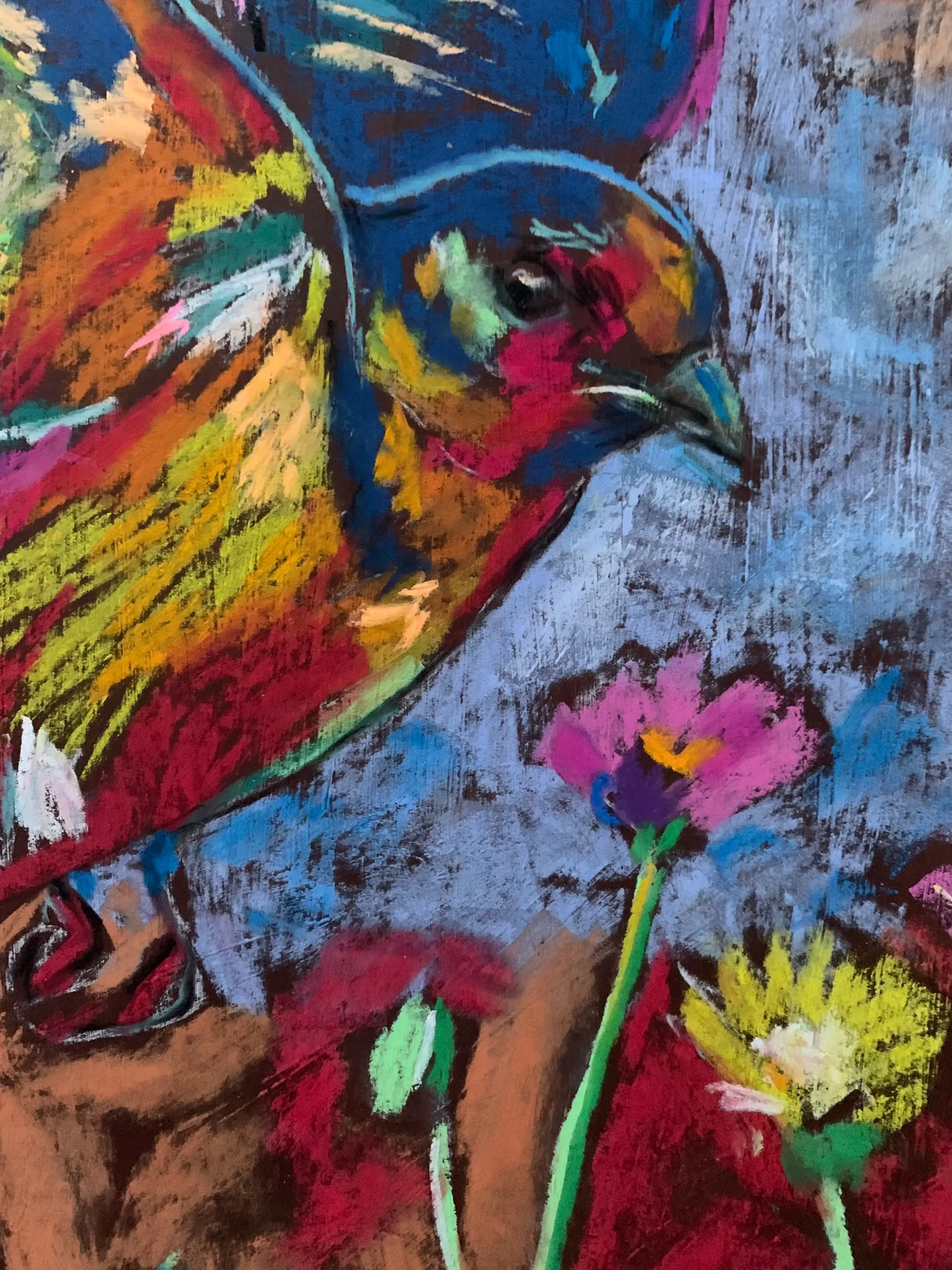 An original expressionist flying colorful bird painting in soft pastel, depicting a multicolored bird soaring over a meadow of pink and yellow flowers.