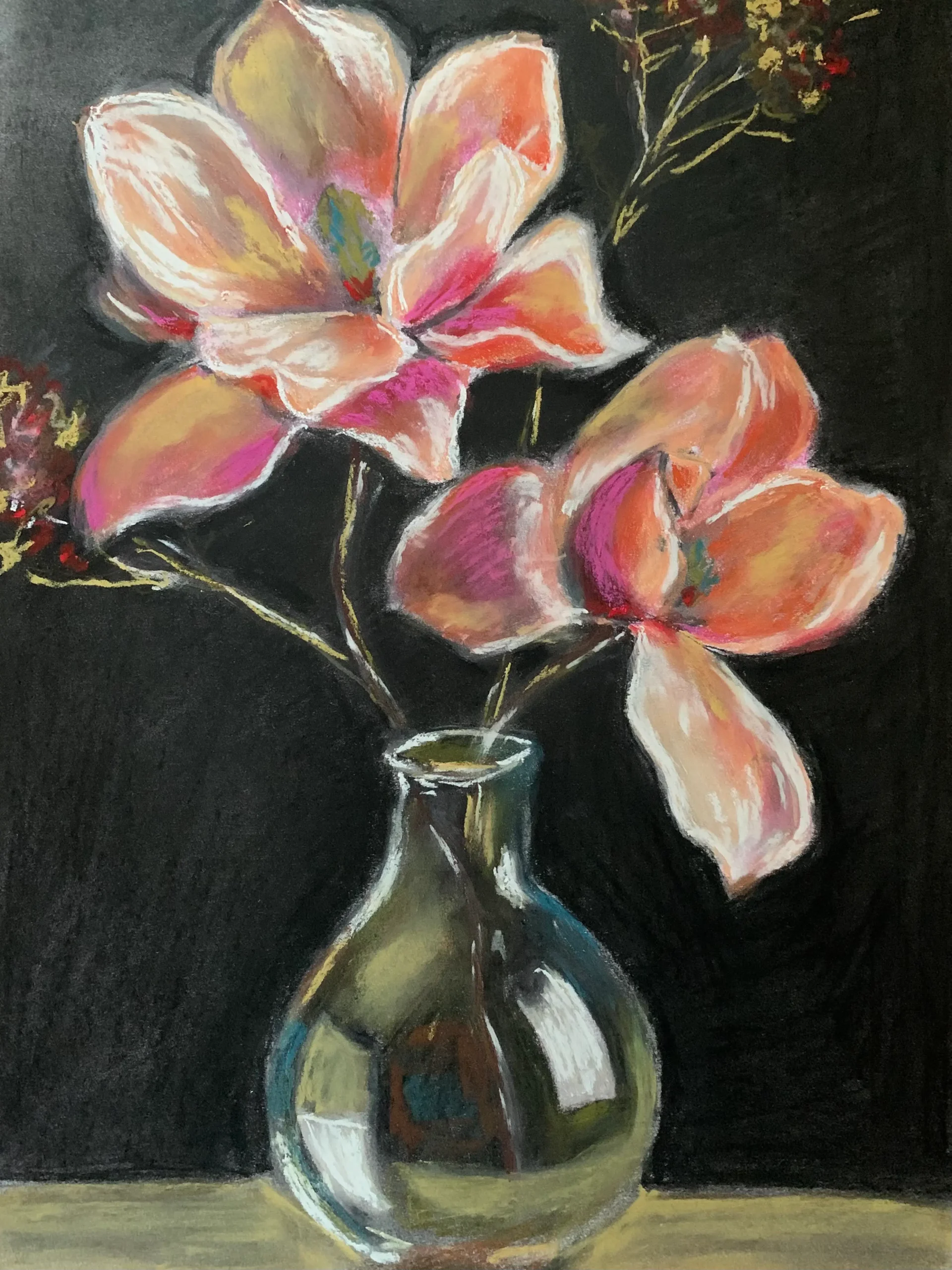 An original expressionist painting in soft pastel of large pink and peach flowers in a reflective glass vase against a dramatic black background.