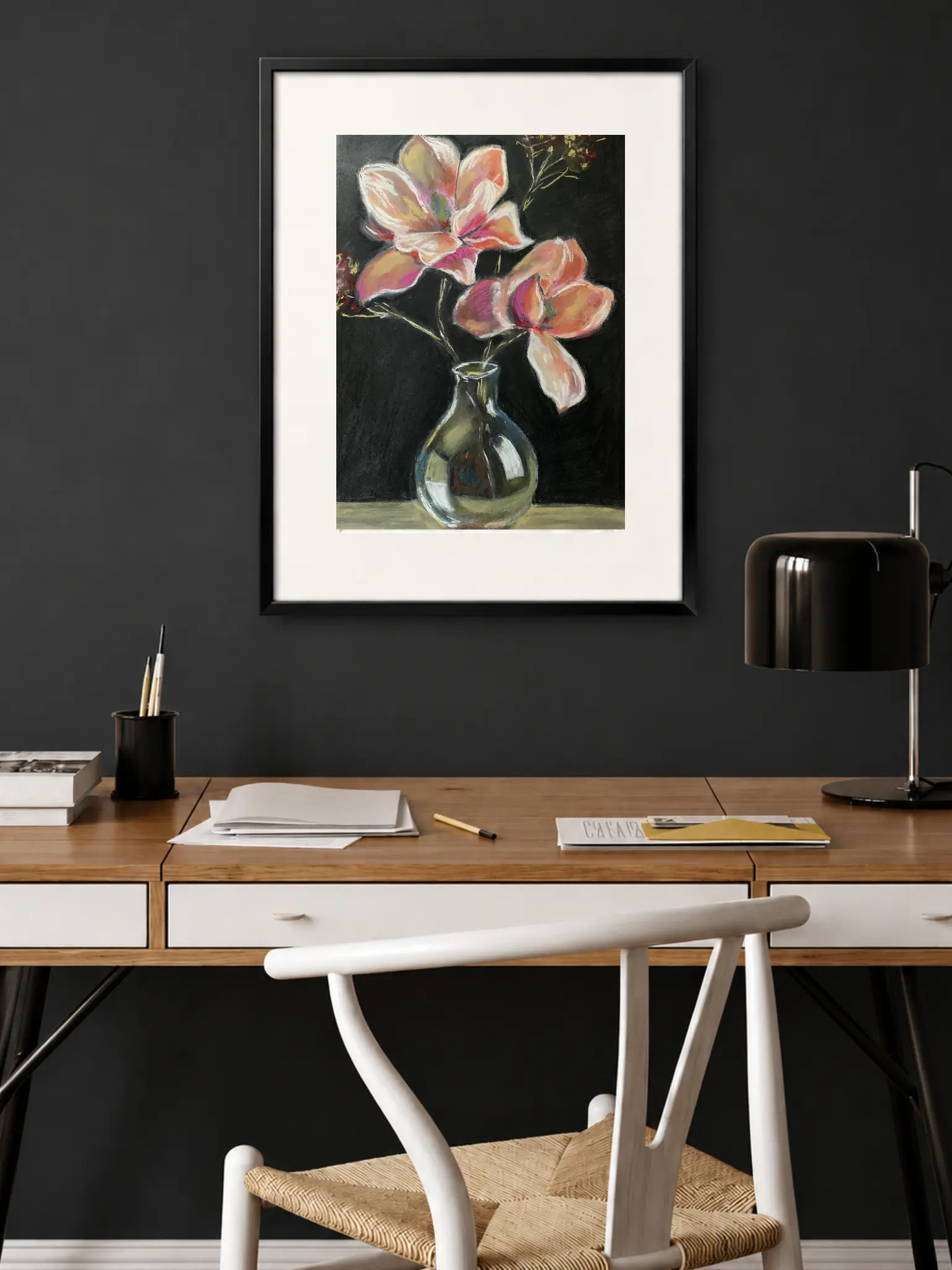 An original expressionist painting in soft pastel of large pink and peach flowers in a reflective glass vase against a dramatic black background.