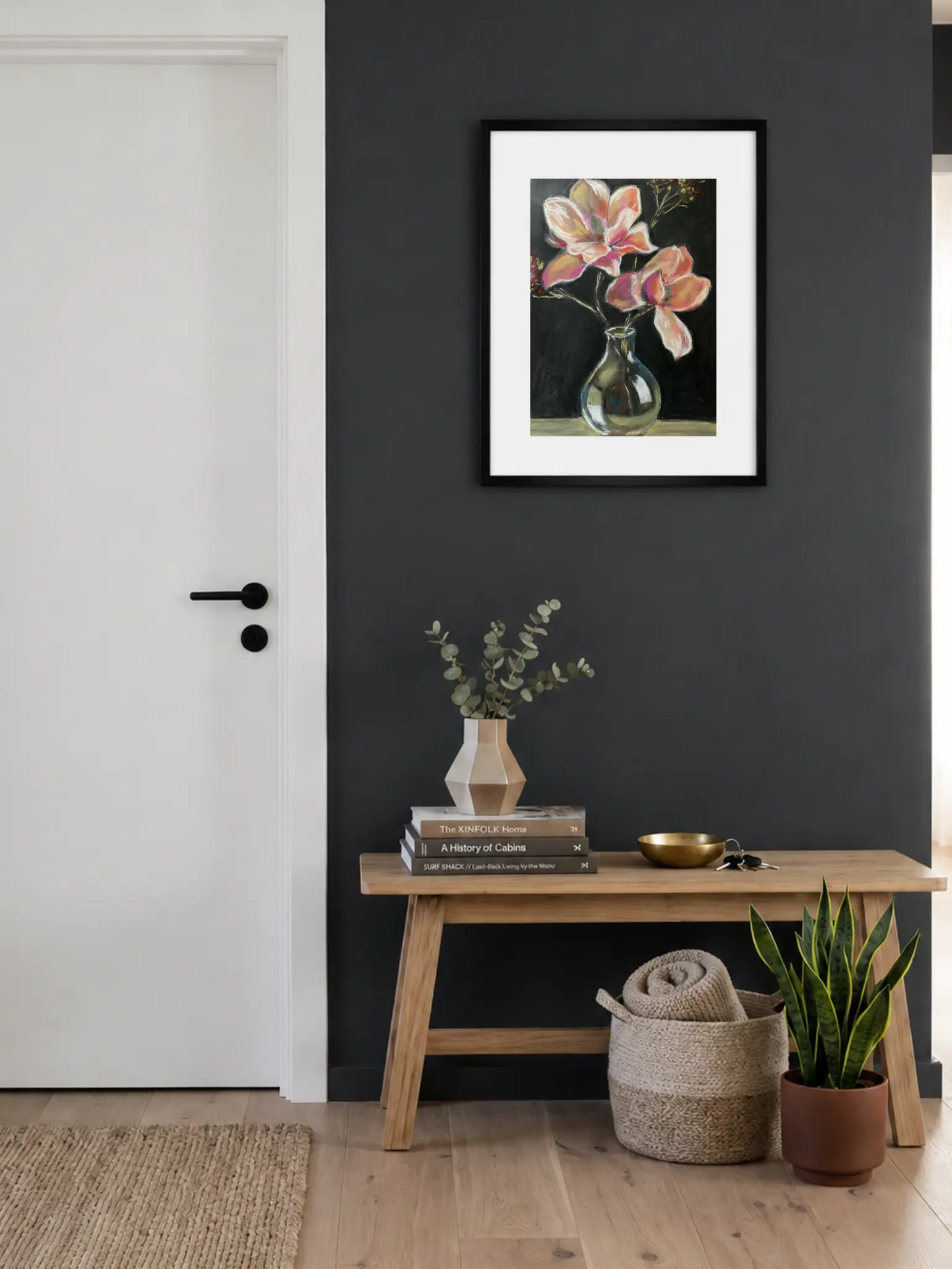An original expressionist painting in soft pastel of large pink and peach flowers in a reflective glass vase against a dramatic black background.