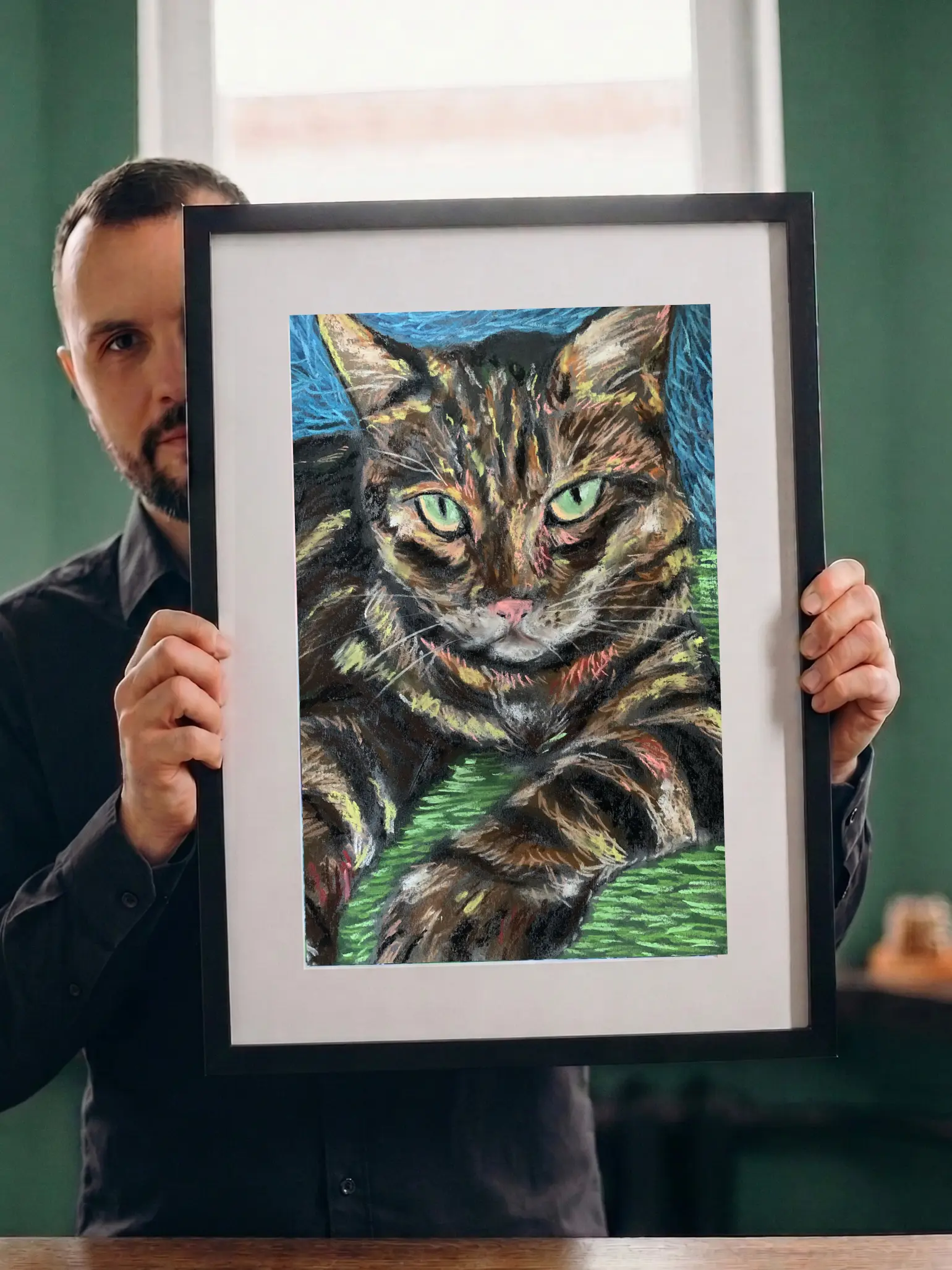 An original expressionist tabby cat portrait painting in soft pastel by Savchenko, depicting a striped brown cat with bright green eyes and a pink nose resting on a green surface against a blue background.