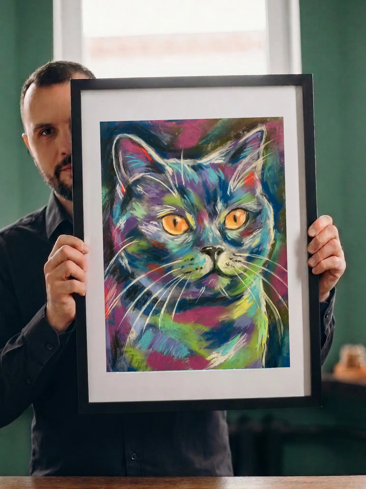 Artist holding framed expressionist soft pastel amber-eyed cat portrait painting