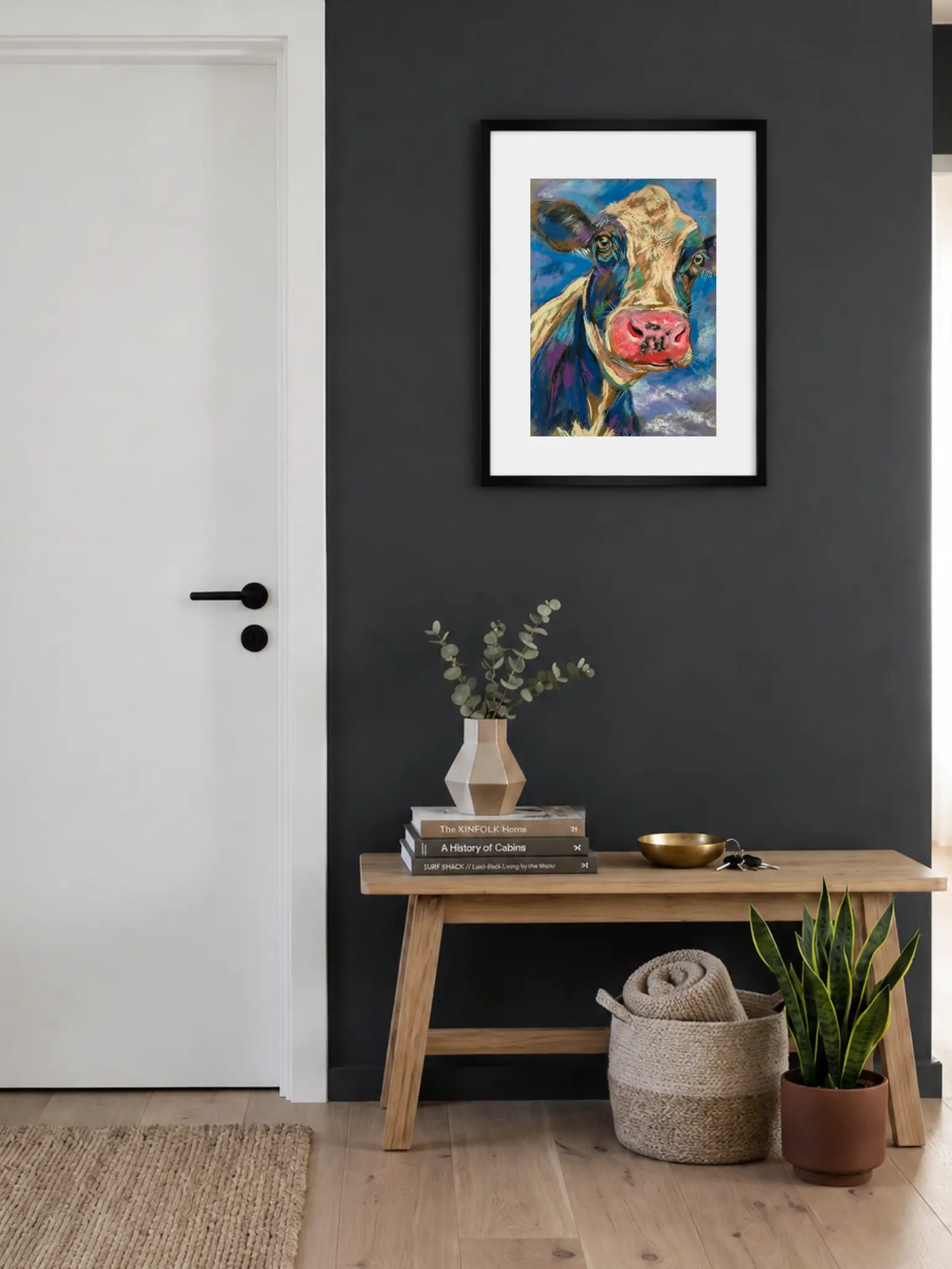 Framed expressionist soft pastel cow portrait painting in entryway interior